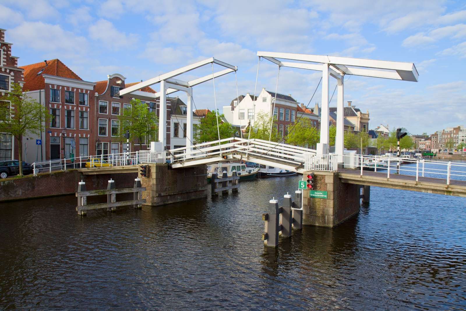 White drawbridge over a canal in a Dutch town