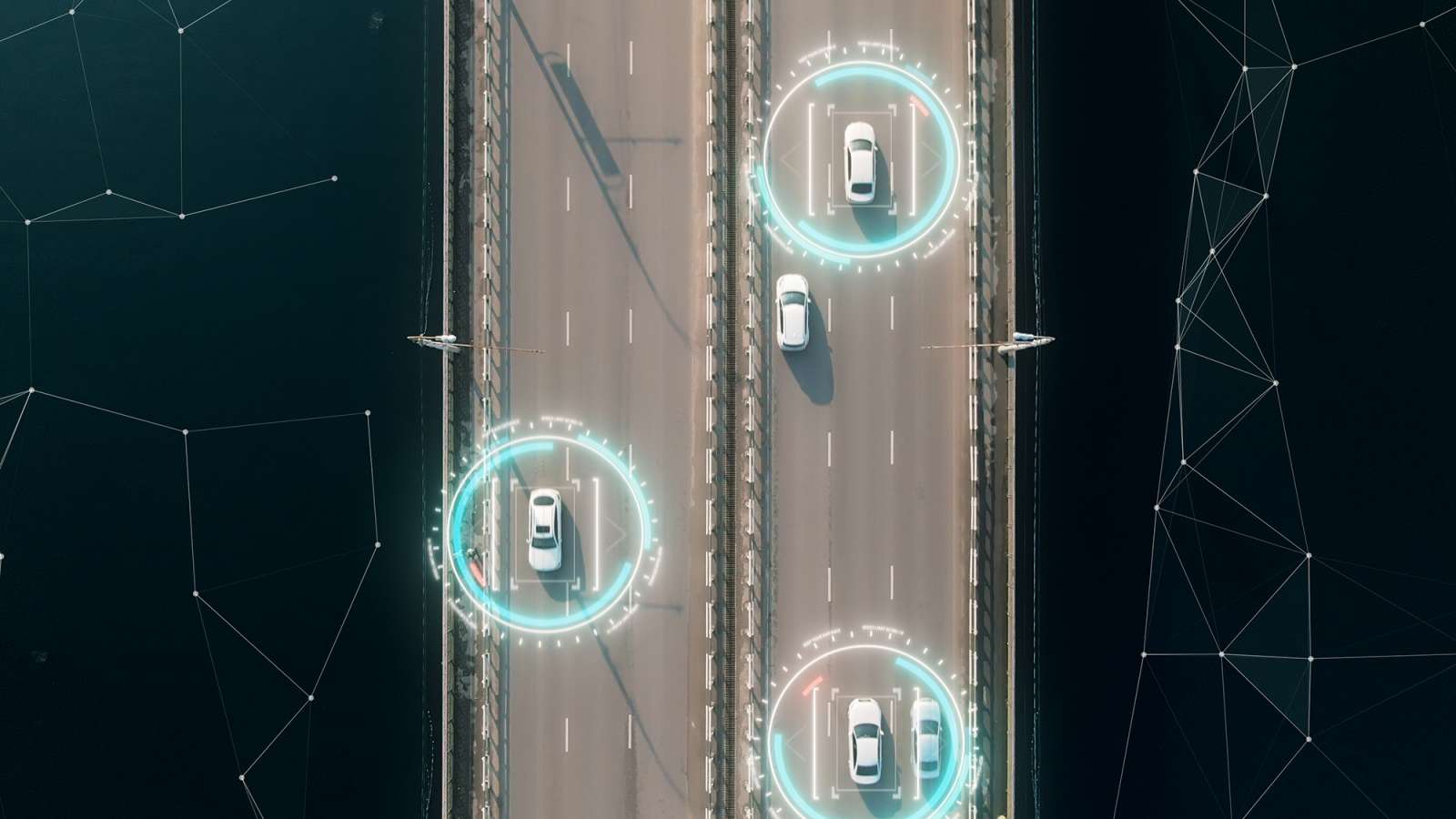 Aerial view of a bridge with cars highlighted by digital connectivity rings and network lines
