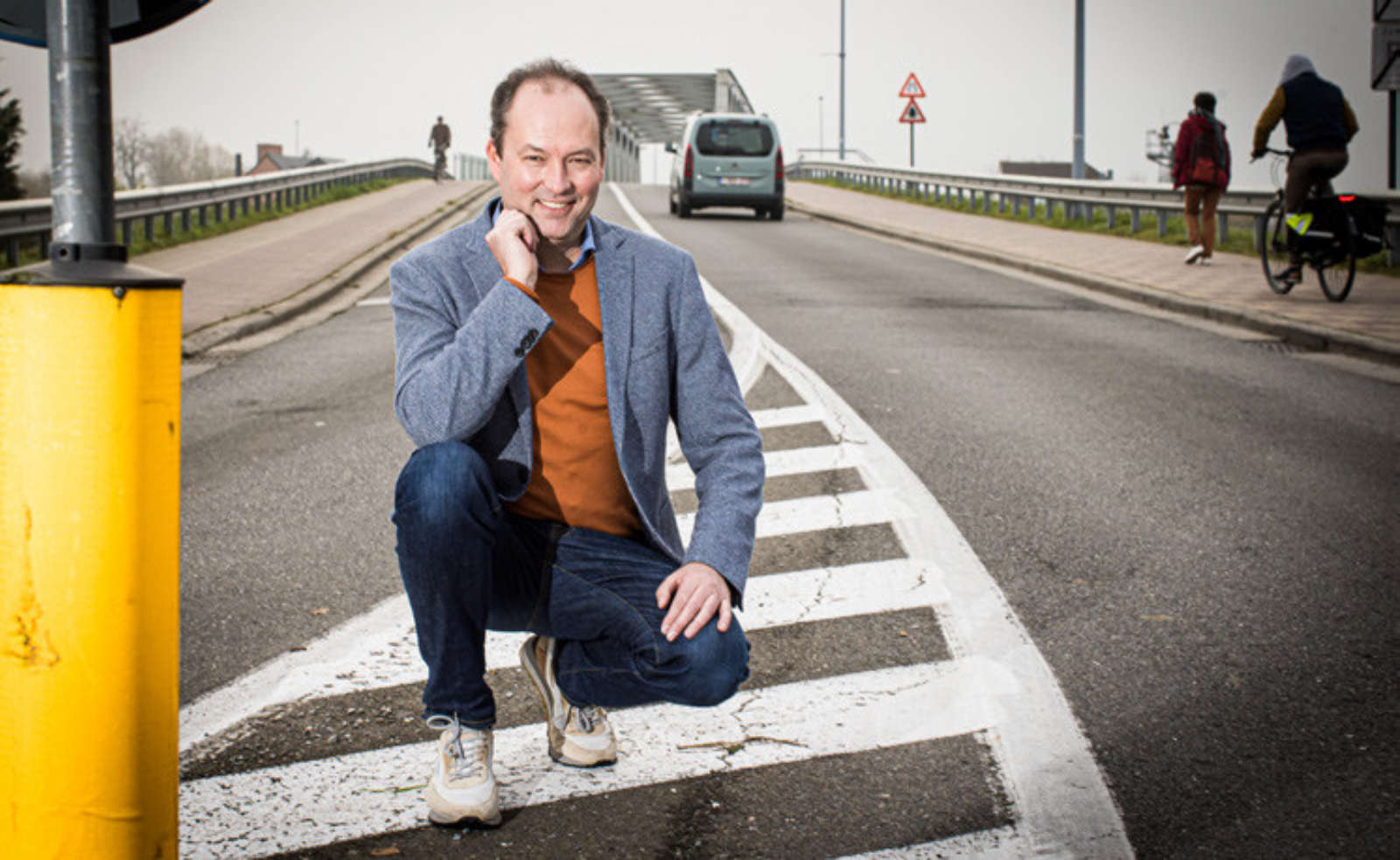 Bart Lannoo on a road near Be-Mobile, illustrating connected-vehicle infrastructure.