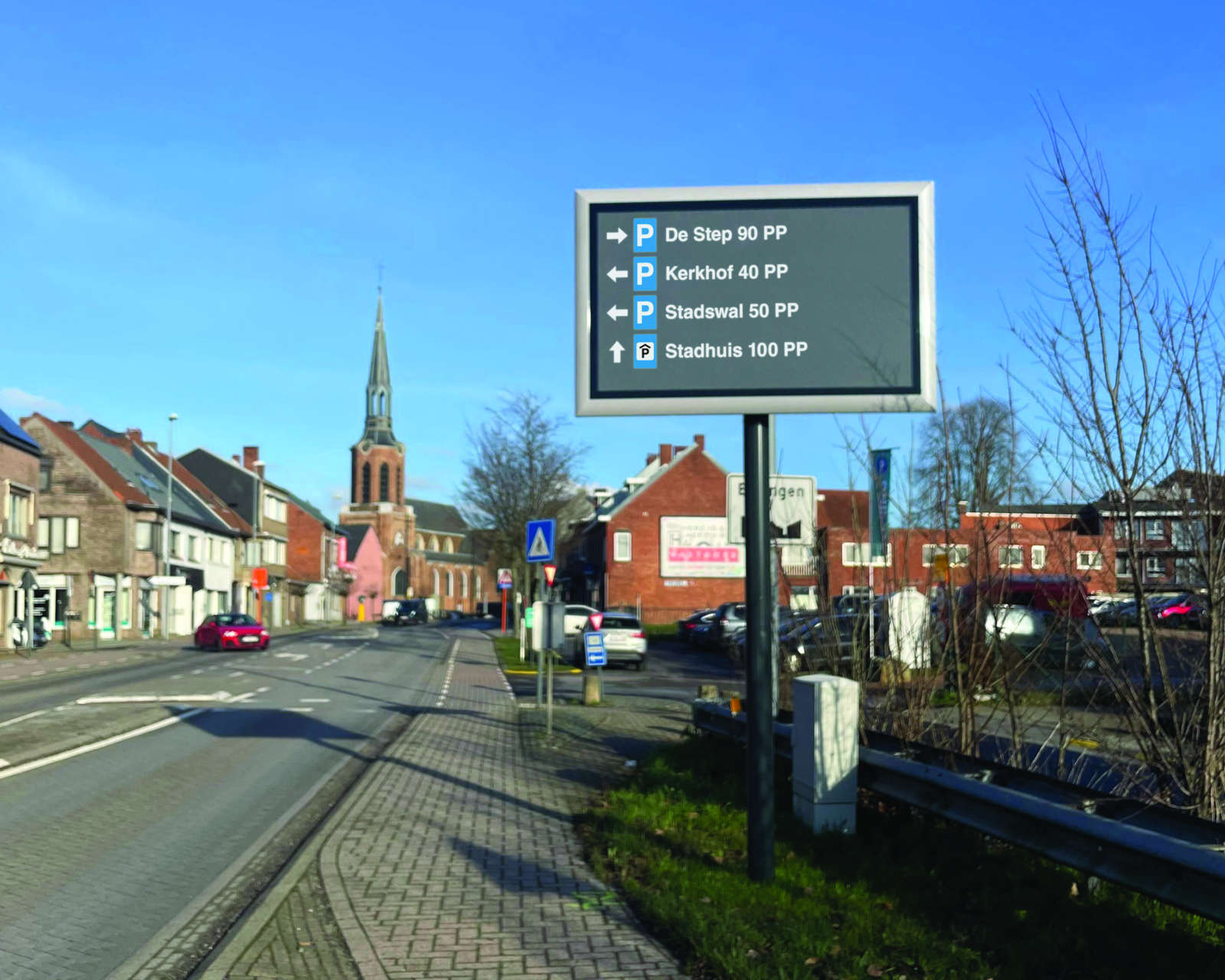 Dynamic parking guidance sign on a Beringen approach road showing live parking capacity — Be-Mobile parking guidance system