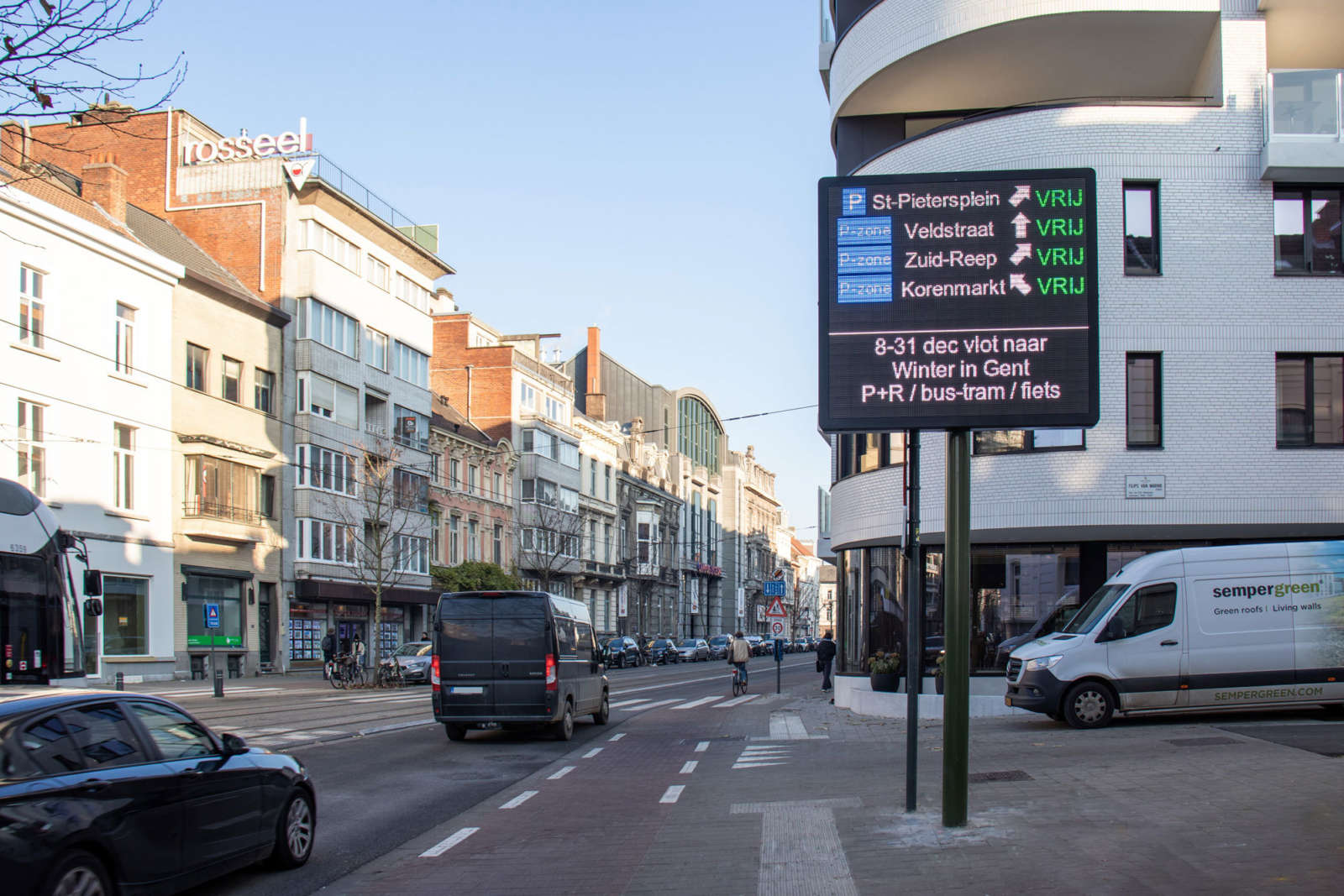 Dynamic LED parking guidance sign in central Ghent showing real-time parking availability — Be-Mobile traffic management system